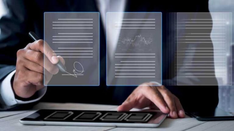 Businessman writing and using tablet — Aipick Zone