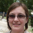 Woman with glasses in gray shirt — Aipick Zone